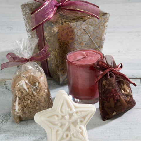 Collection of Holiday Gifts in a take out box with a candle, star soap, sachet and bath salts