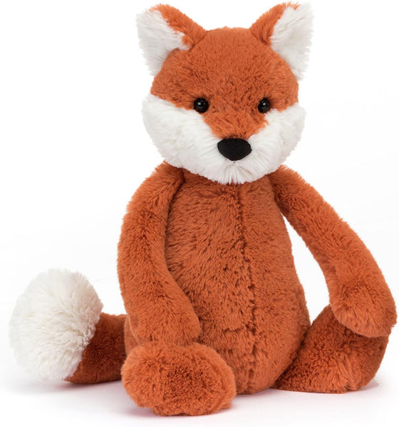 orange fox with white ears and tail